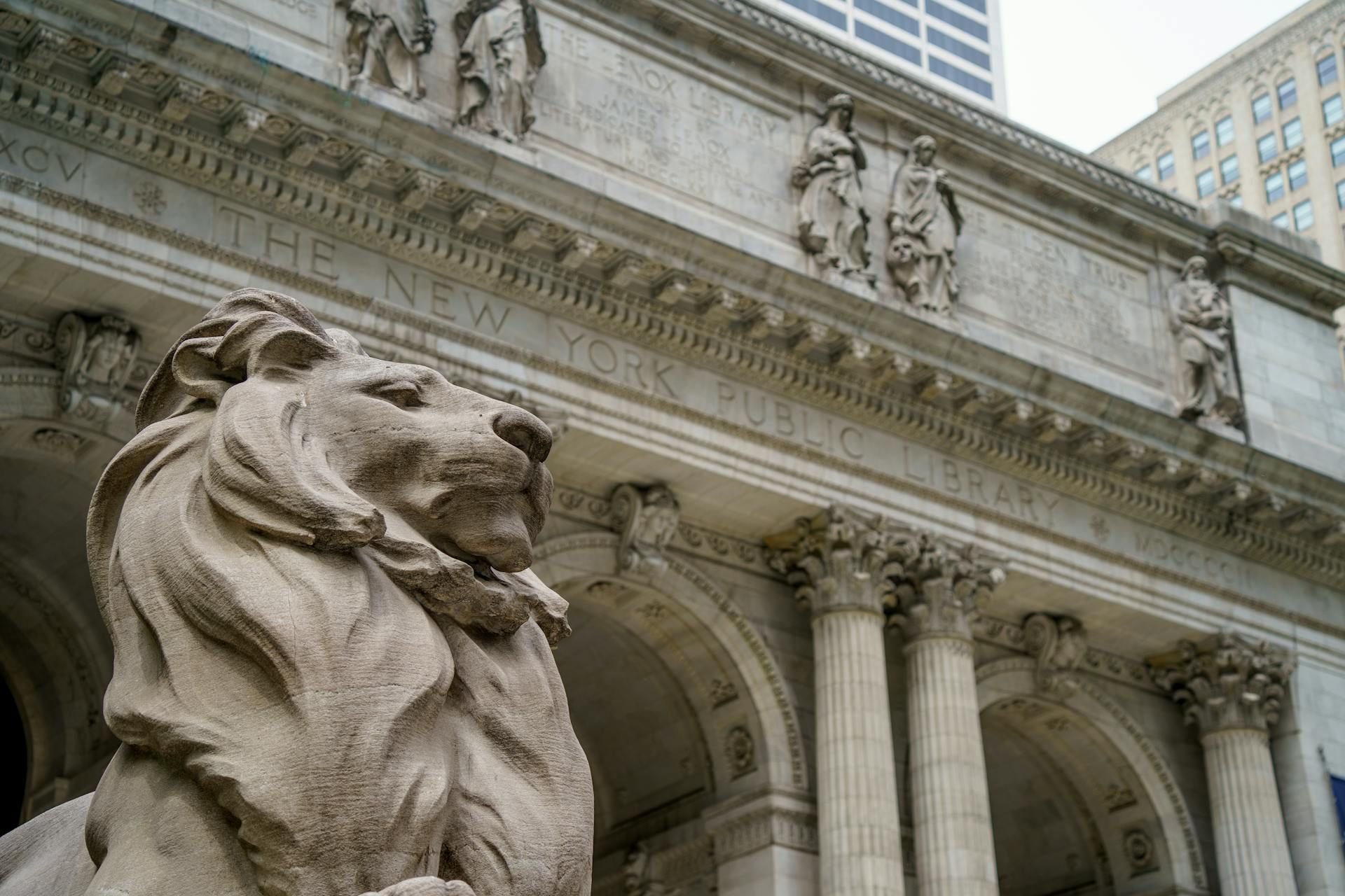 A statue in front of the New York Public Library