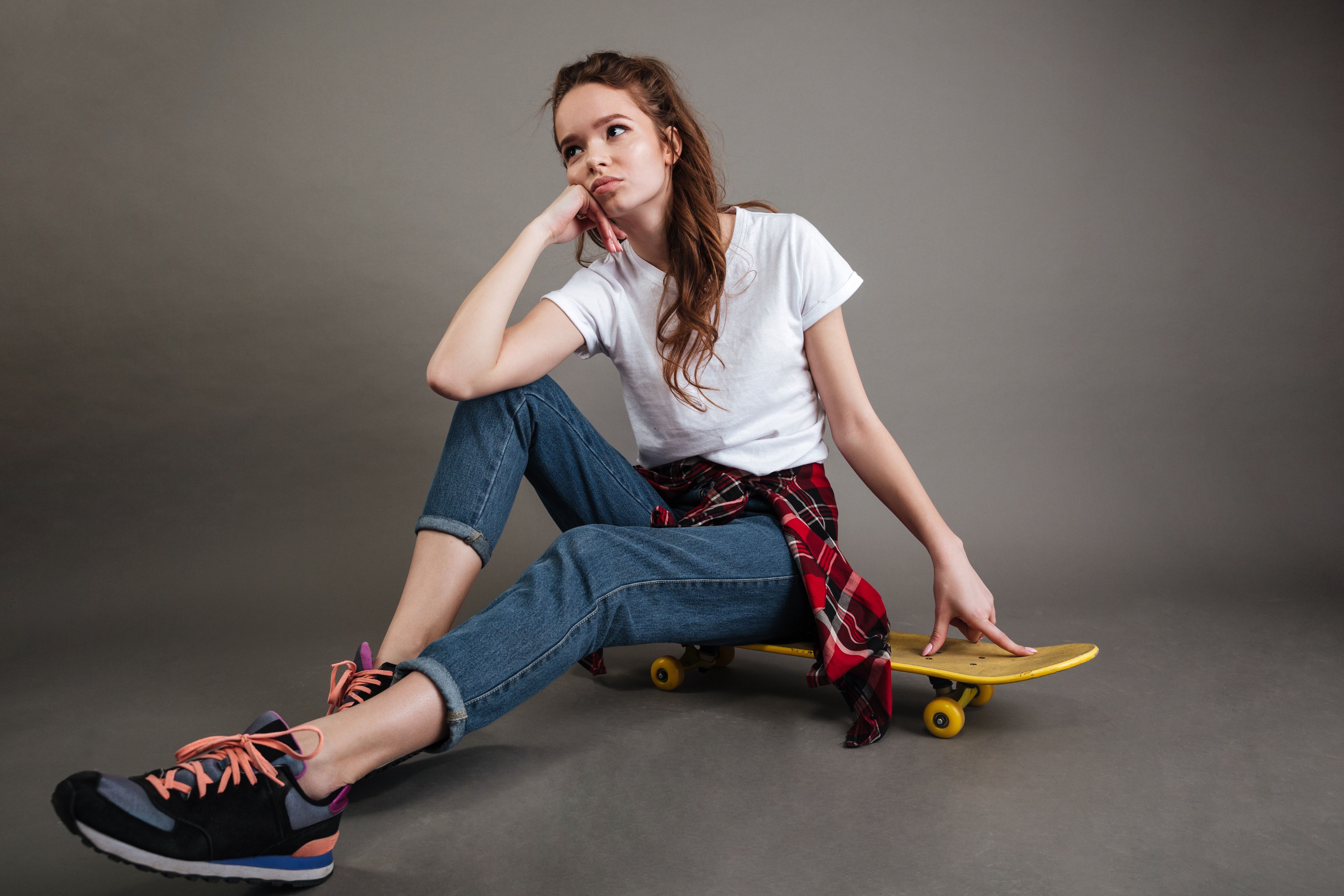 portrait-young-teenage-girl-sitting-skateboard.jpg