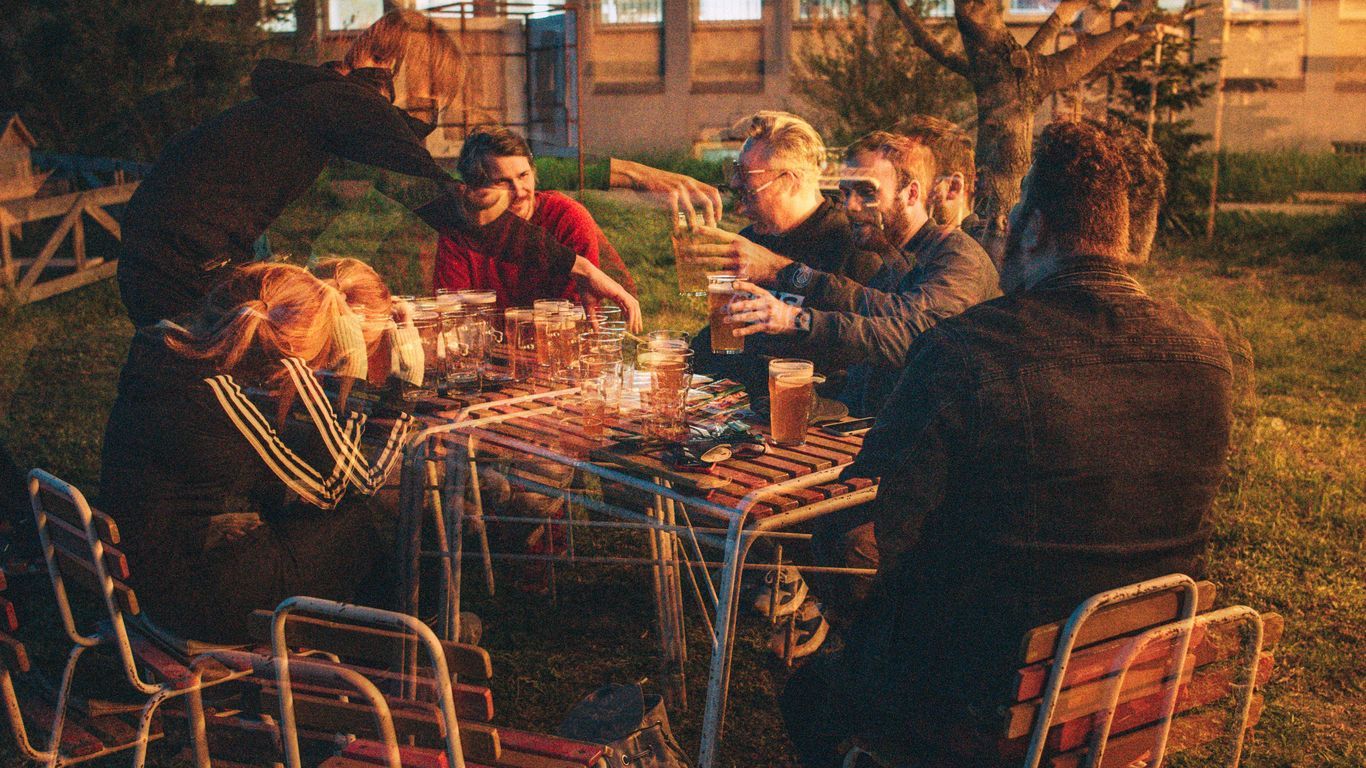 people sitting on chairs in front of table