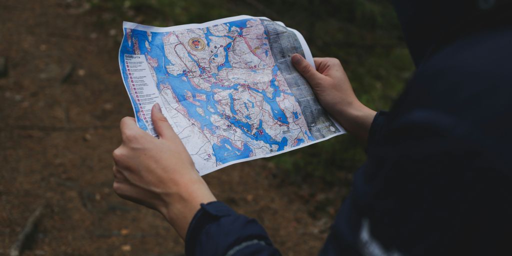 a person holding a map in their hand