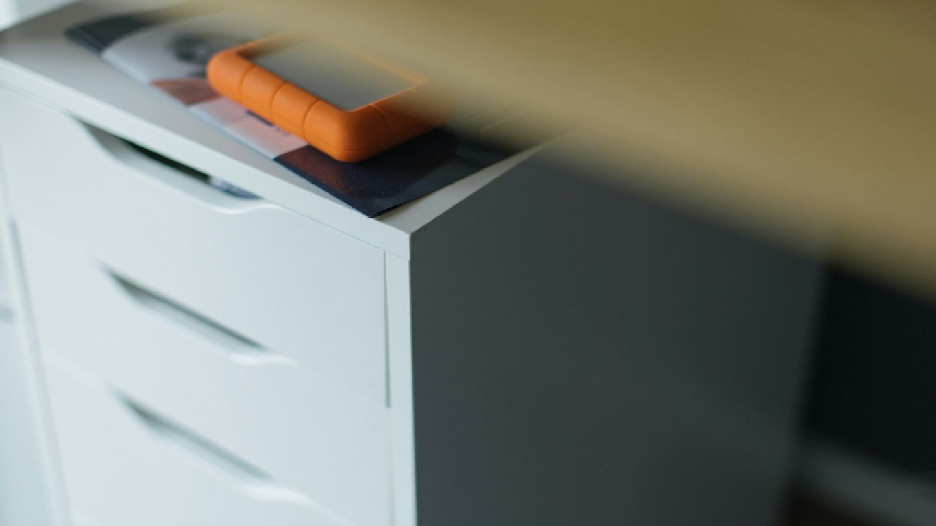 A drawer with a carrot on top of it