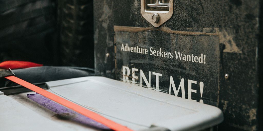 white plastic container beside rent me signage