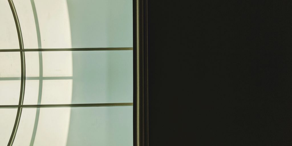 black wooden framed glass window