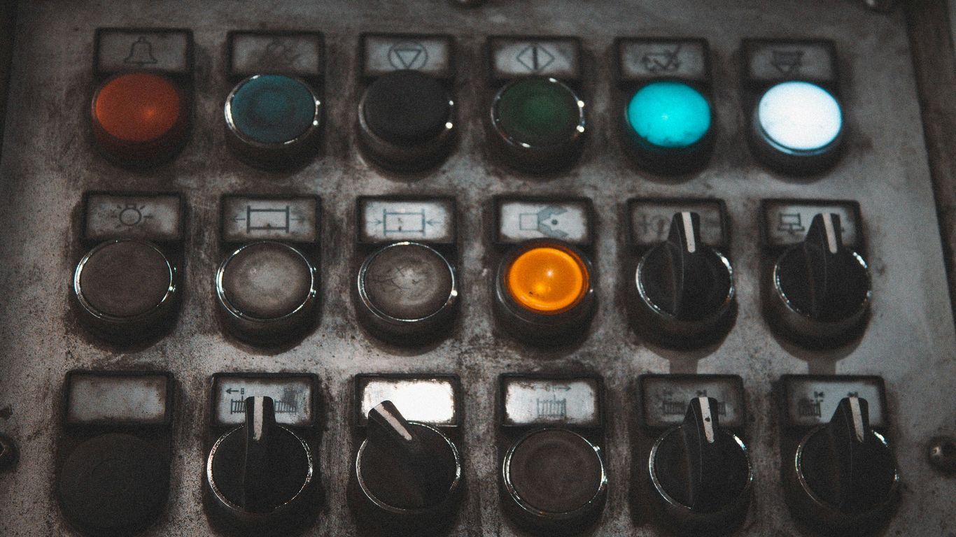 A close up of a control panel with buttons