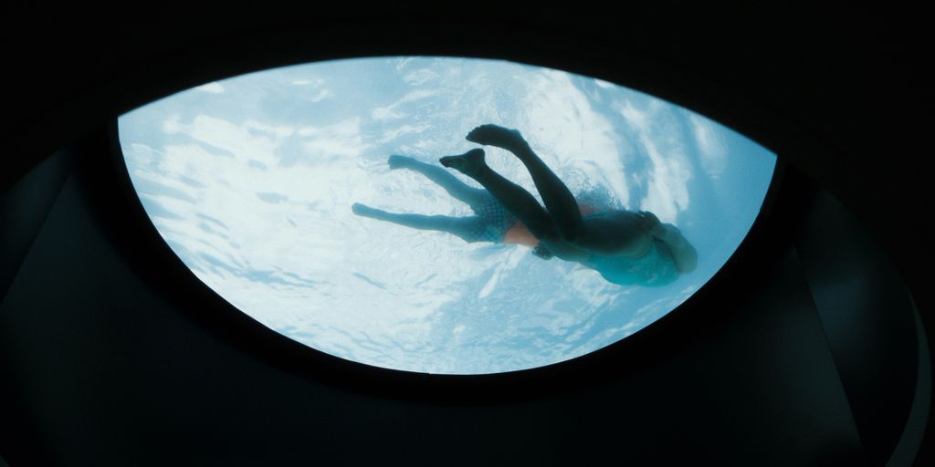 A person swimming in a pool of water