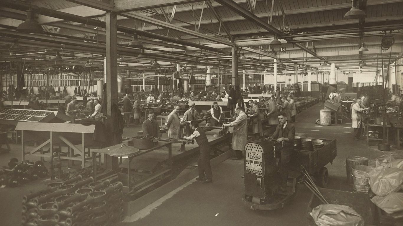 grayscale photo of people in a store