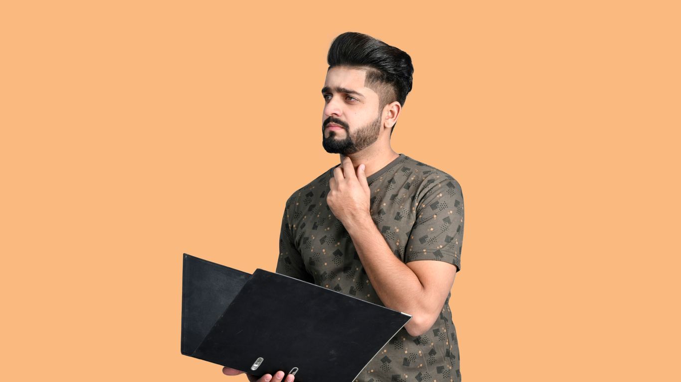 a man holding a laptop