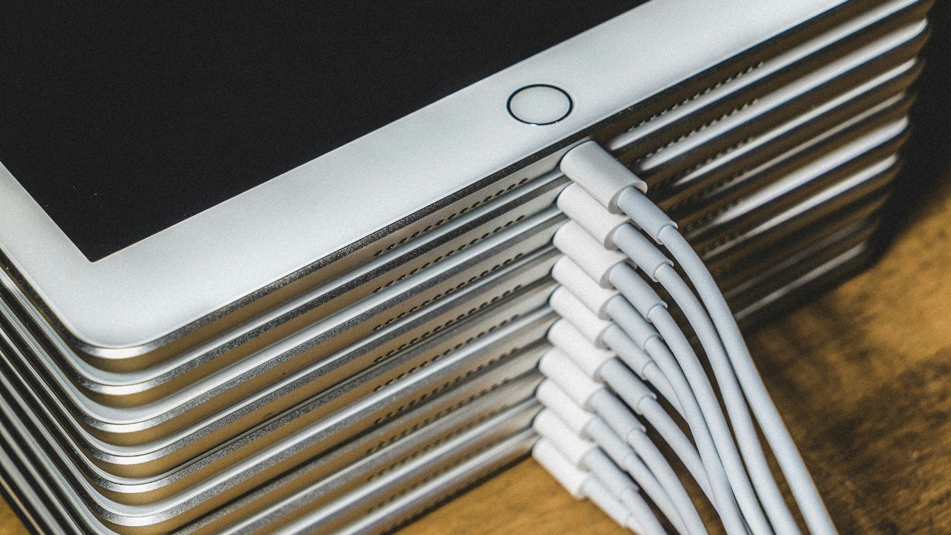 silver imac on brown wooden table