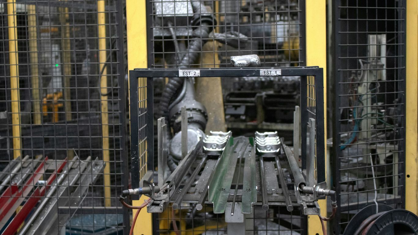A large machine in a factory with lots of metal parts