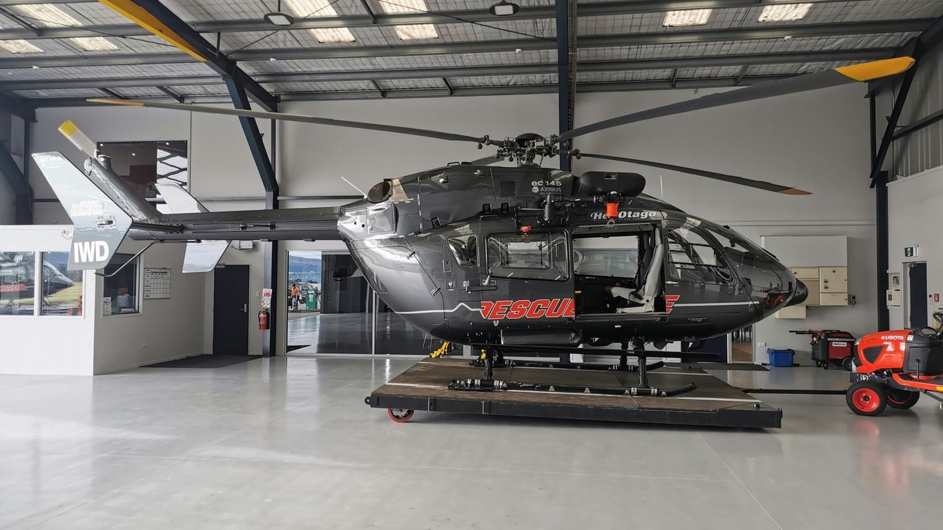 white and black helicopter in a room