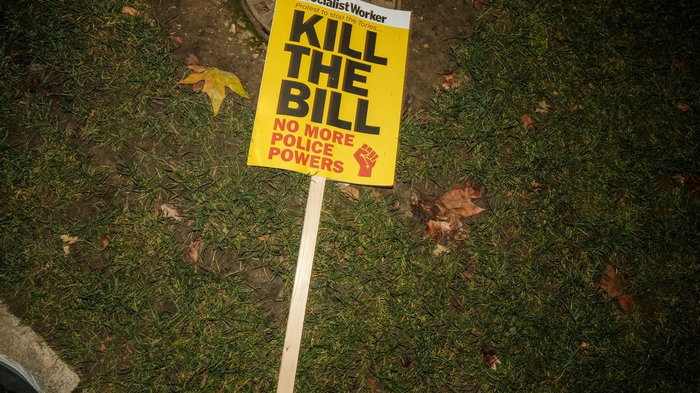 a yellow sign that says kill the bill on it