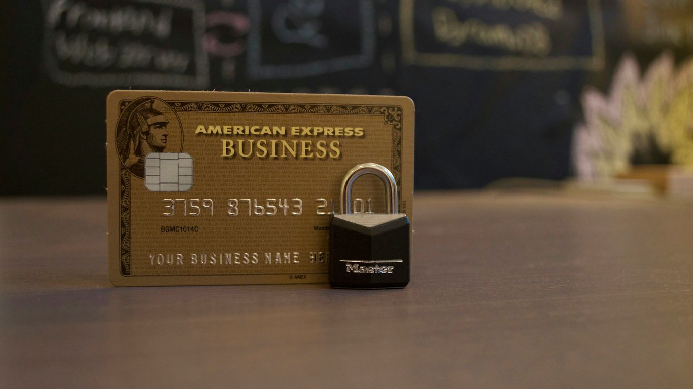 closeup photo of American Express Business card on brown surface