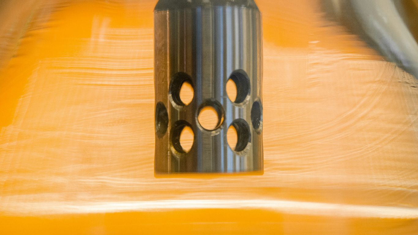 black and silver round metal tool