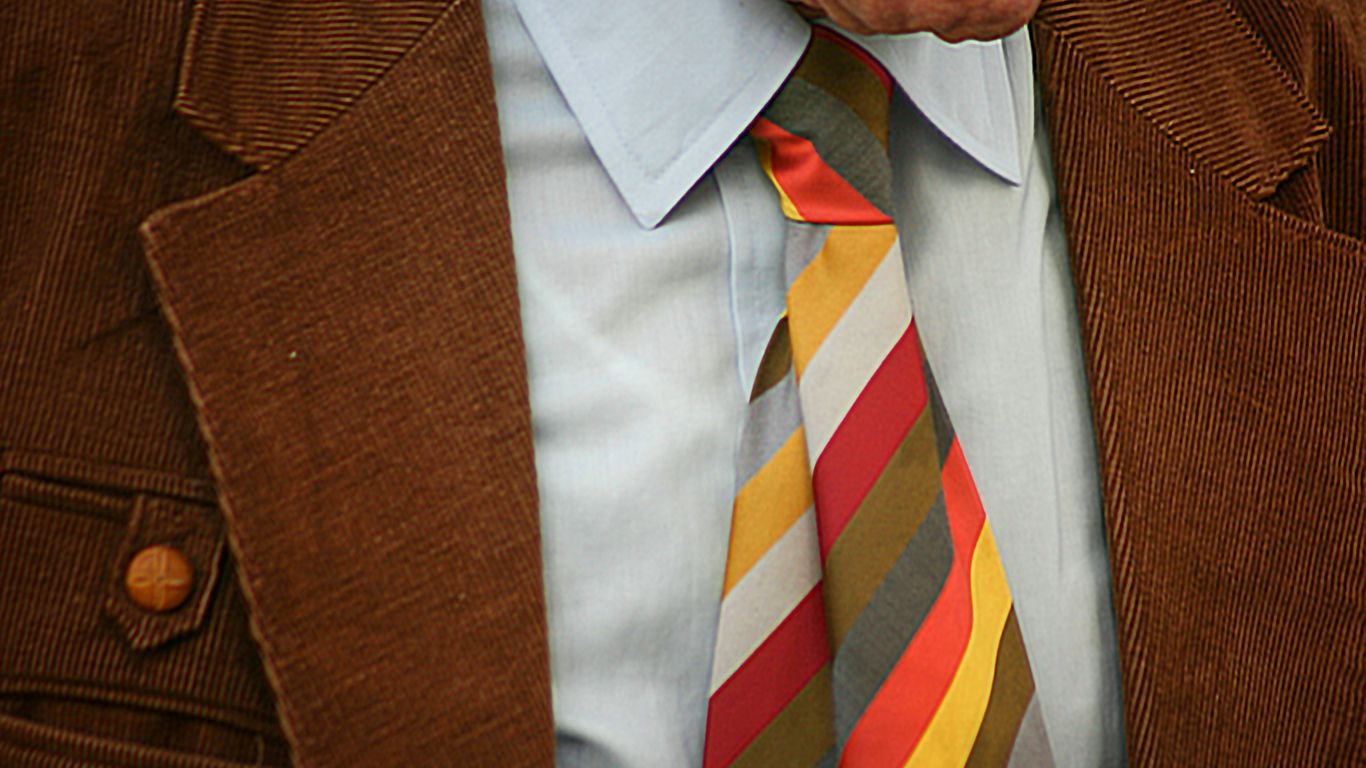 man in brown suit jacket