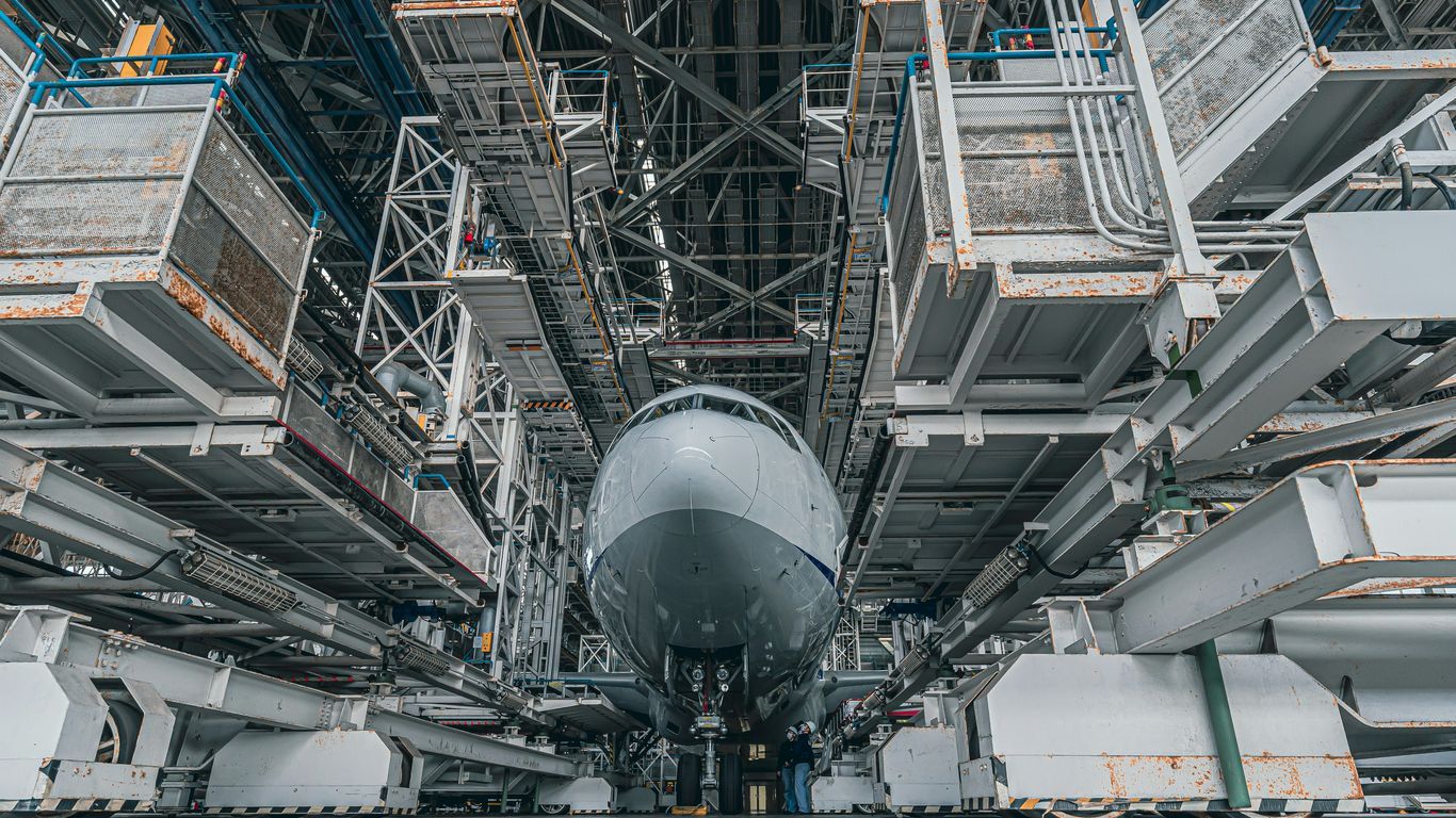 a large jetliner sitting on top of an airport tarmac