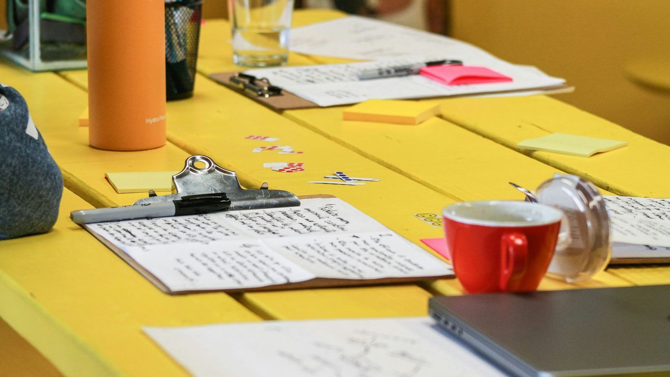 a table with a cup and a pencil on it