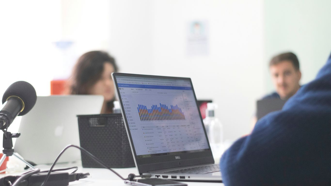 black and silver laptop computer on white table