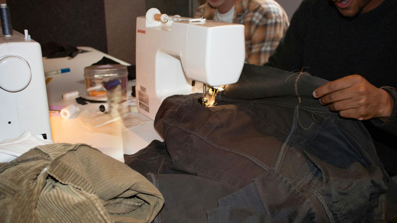 People are sewing clothes with sewing machines.