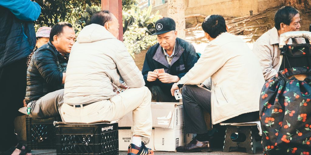 four man sitting on the chair