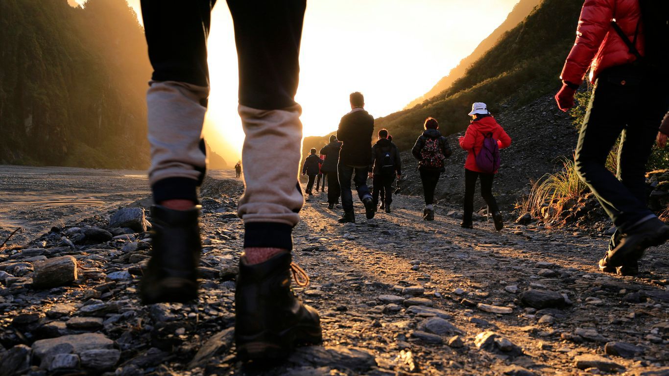 person wearing black work boots