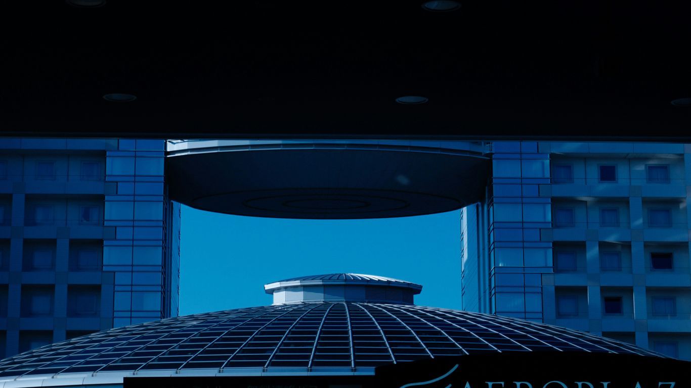 A view of a building with a sign in front of it