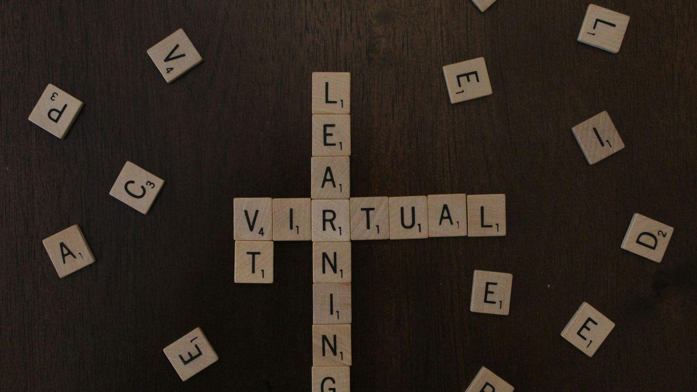 black and white letter blocks on brown wooden table