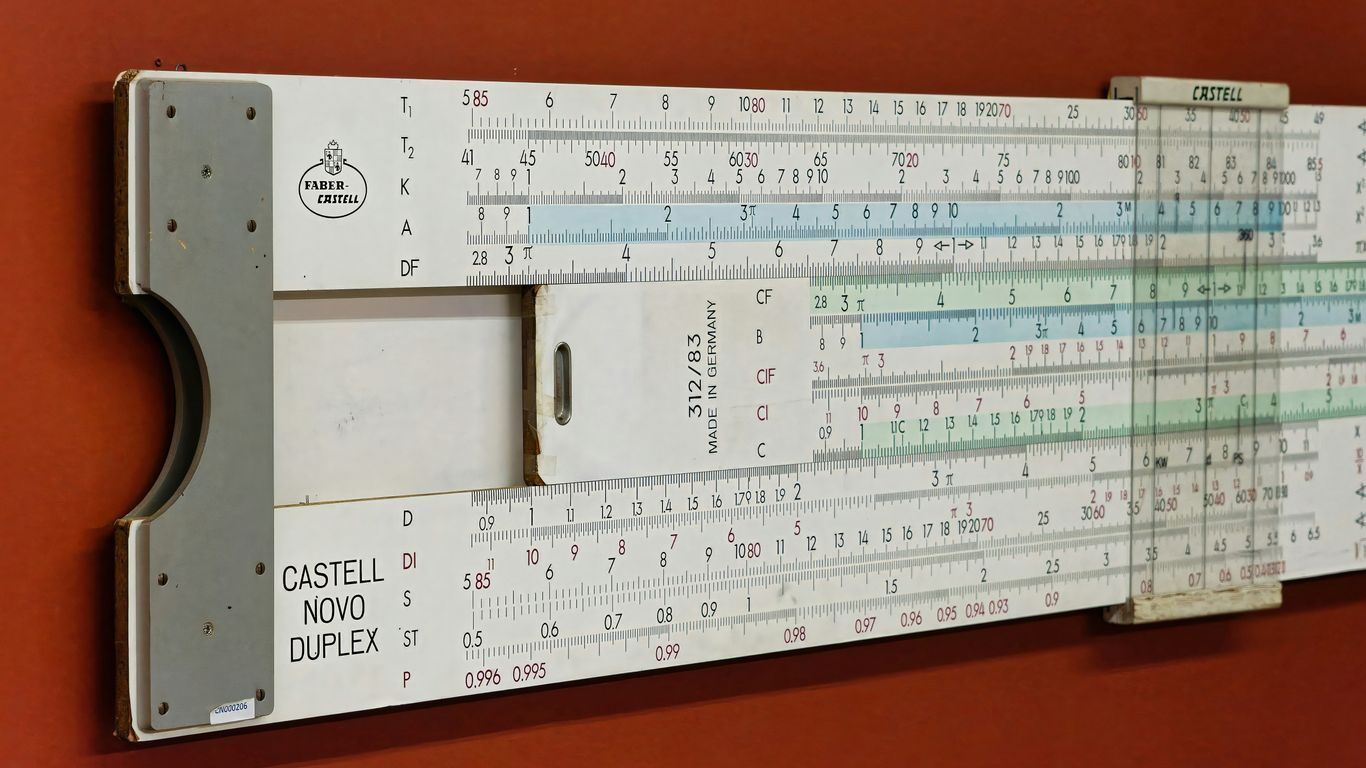 A large ruler mounted to the side of a wall