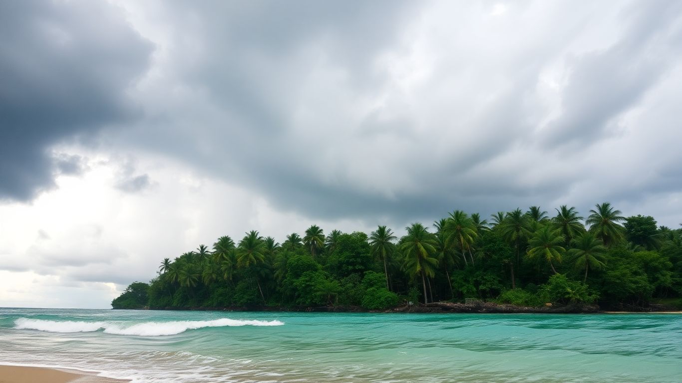 Rainy Malaysian coast with stormy skies and crashing waves.