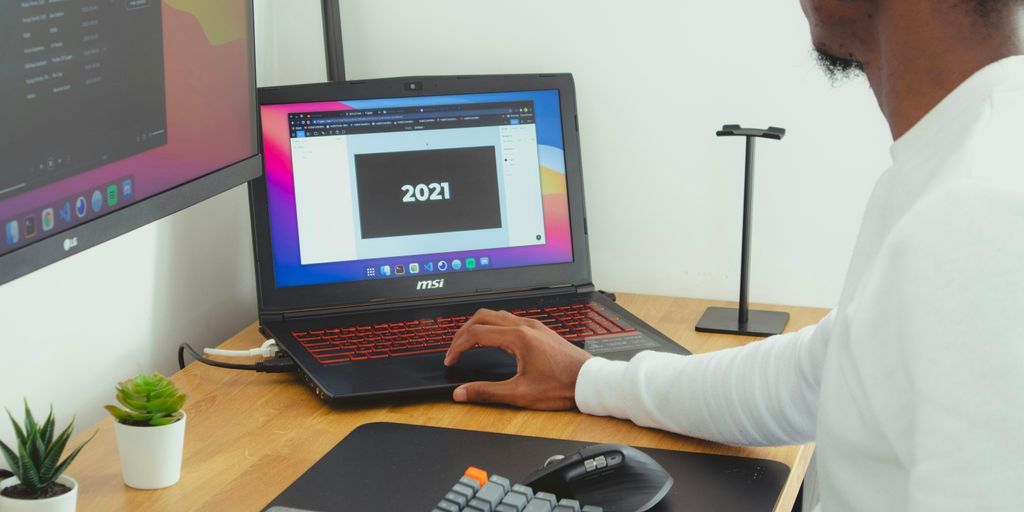 person using black laptop computer