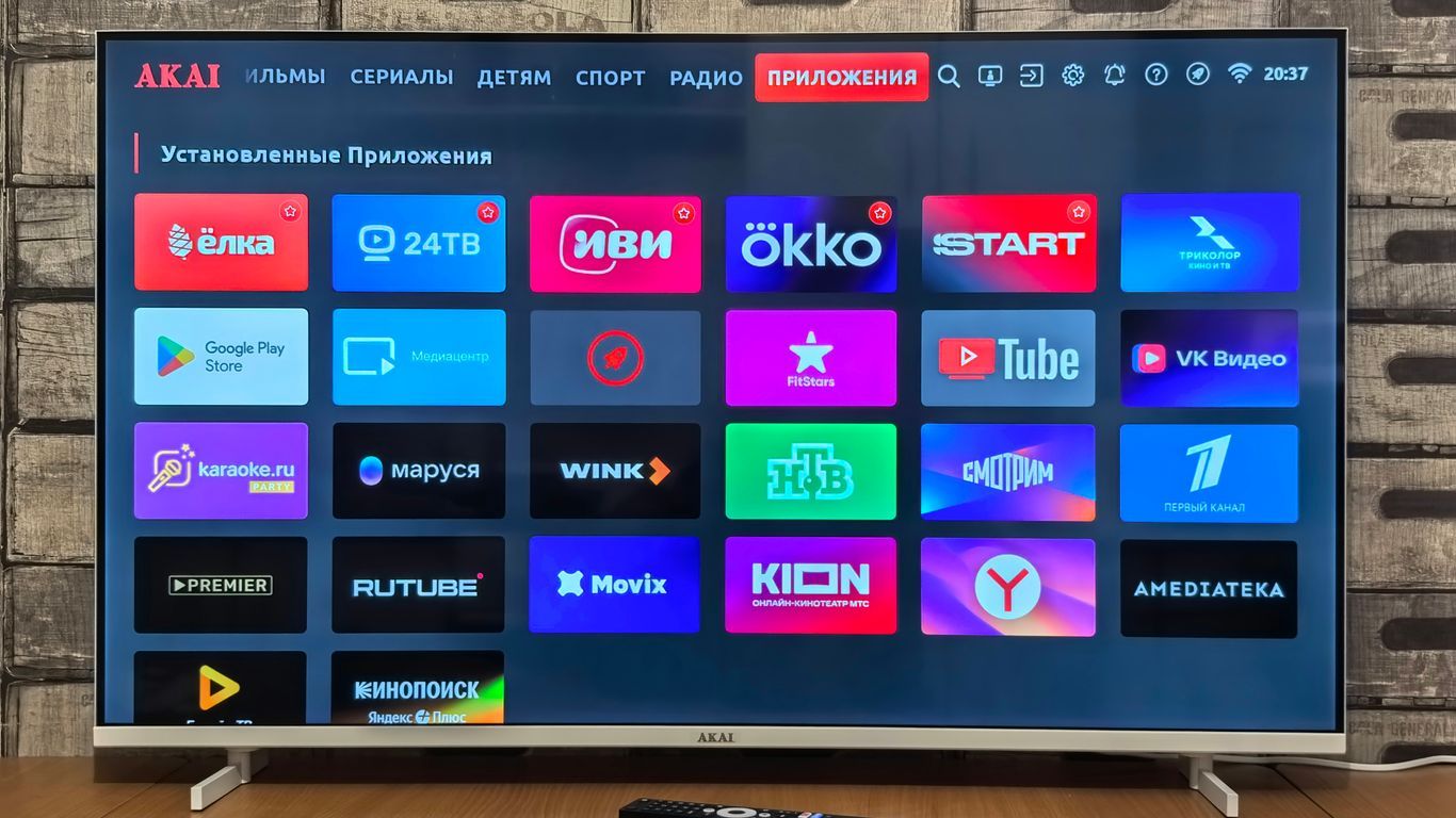Smart TV screen displaying various application icons.