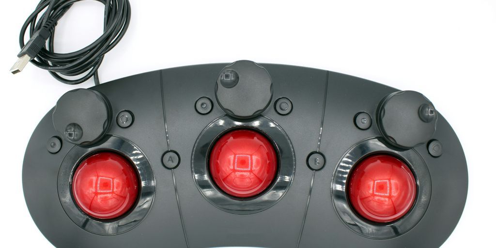 a close up of three red lights on a white surface